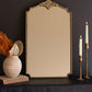 Prop or hang this dressing mirror with a top medallion accent and cut corners. This elegant mirror suits fancy or plain spaces. Add a touch of opulence with this fancy gold-framed mirror. 16" x 27"t