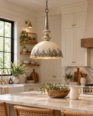 Vintage-inspired farmhouse pendant light with distressed cream, charcoal gray and antique gold finish, hanging above a kitchen island in a French country kitchen.