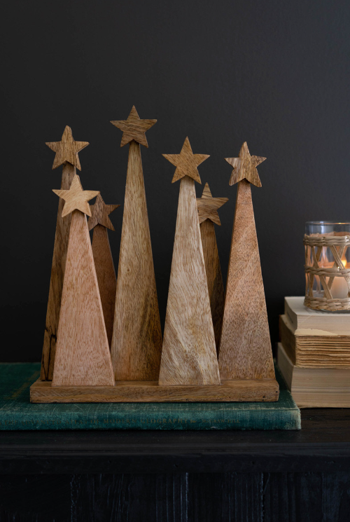 Seven Wooden Christmas Trees on a Base