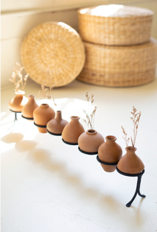 Eight Clay Vessels on an Iron Base